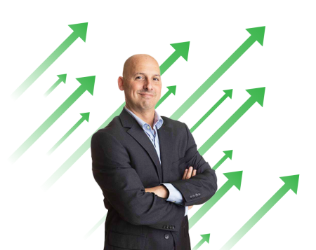 Analyst Kenny Glick stands arms crossed in front of green arrows pointing to upper right